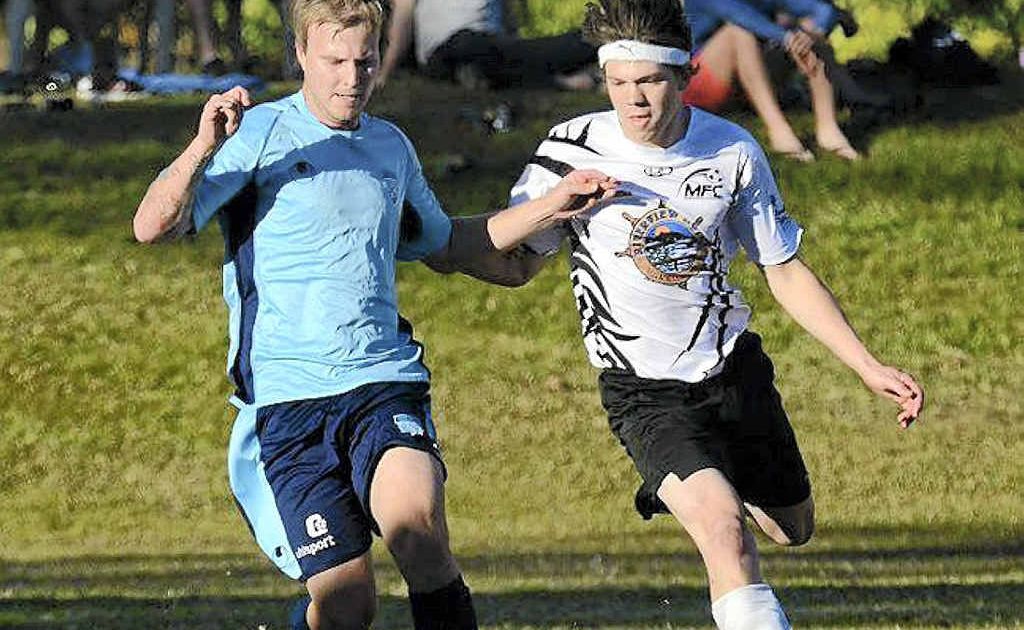 Tait Burns (Tweed United) and MFC's Adam Rogers fight for possession in last week's game. Tait Burns (Tweed United) and MFC's Adam Rogers fight for possession in last week's game.